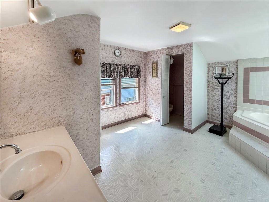 450 Clay Street Rochester, PA 15074 - Photo 21 of 34 a view of a bathroom with a sink and mirror