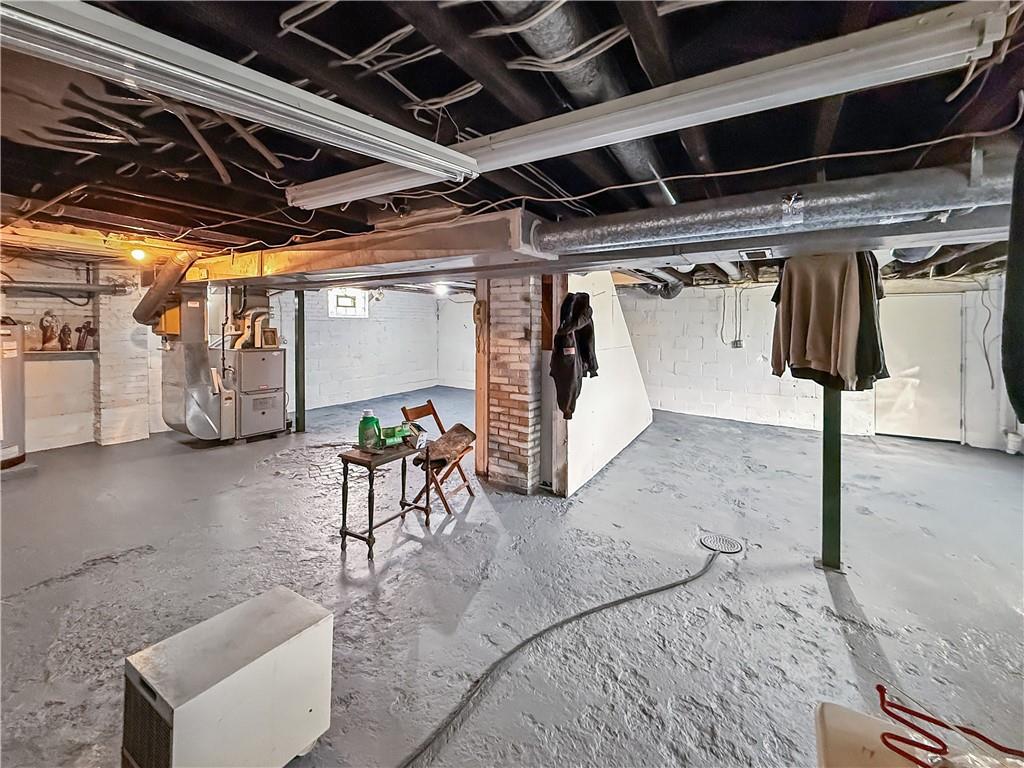 450 Clay Street Rochester, PA 15074 - Photo 25 of 34 a view of a garage with wooden table and chairs