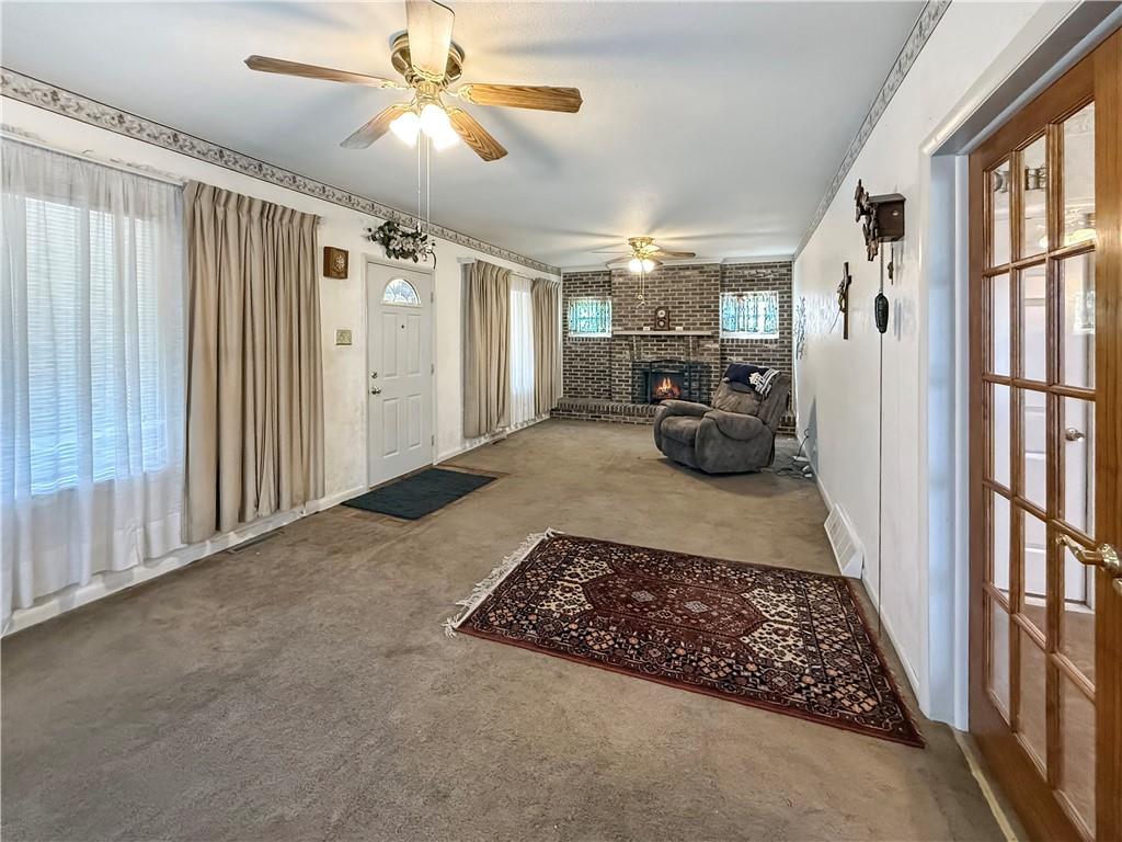 450 Clay Street Rochester, PA 15074 - Photo 4 of 34 a bed room with a bed and a chandelier