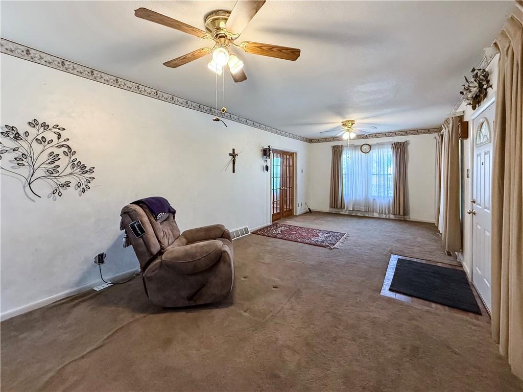 450 Clay Street Rochester, PA 15074 - Photo 5 of 34 a living room with furniture and a chandelier