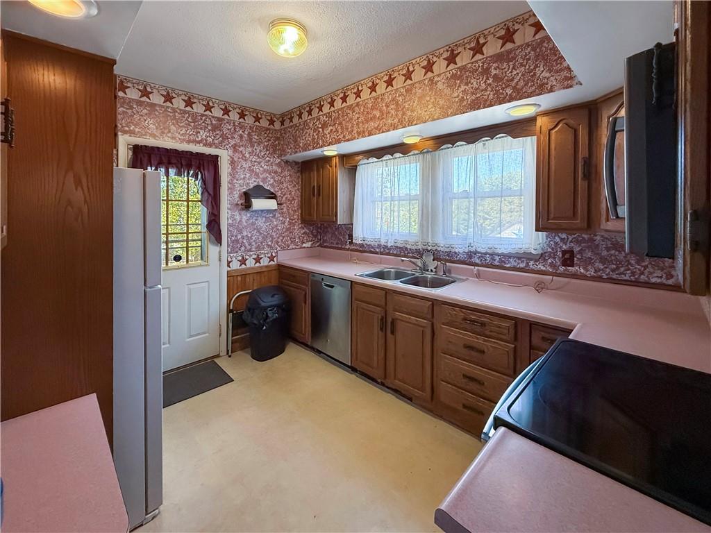 450 Clay Street Rochester, PA 15074 - Photo 9 of 34 a kitchen with a sink stove and cabinets