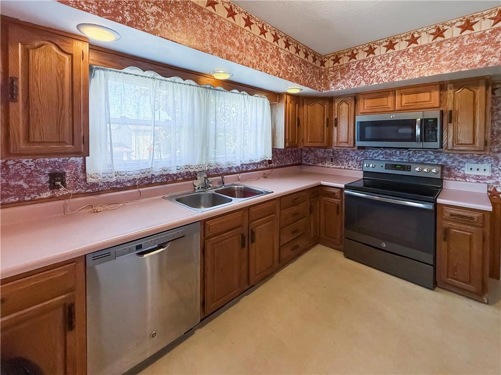 450 Clay Street Rochester, PA 15074 - Photo 10 of 34 a kitchen with stainless steel appliances a sink stove and cabinets