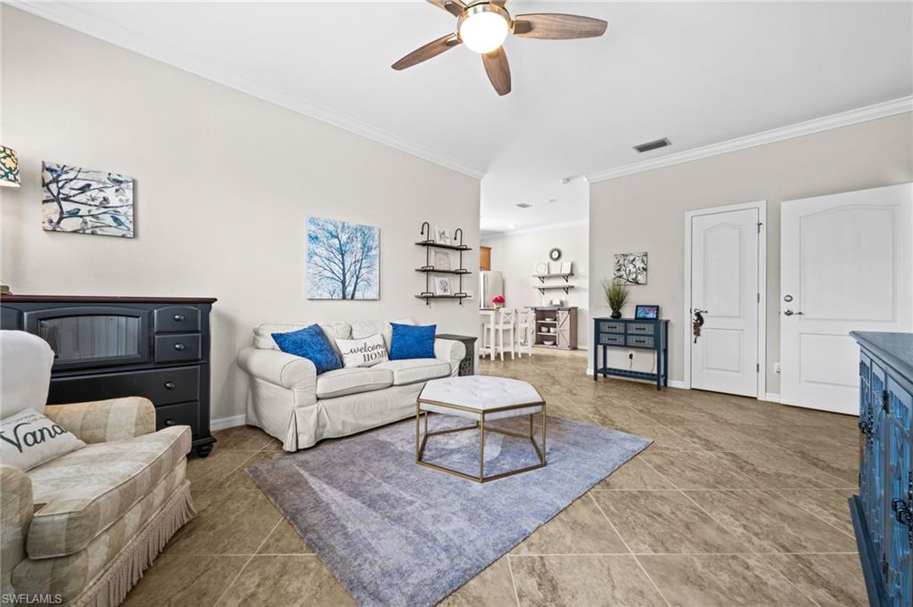 4754 Abaca Circle Naples, FL 34119 - Photo 29 of 46 a living room with furniture and a rug