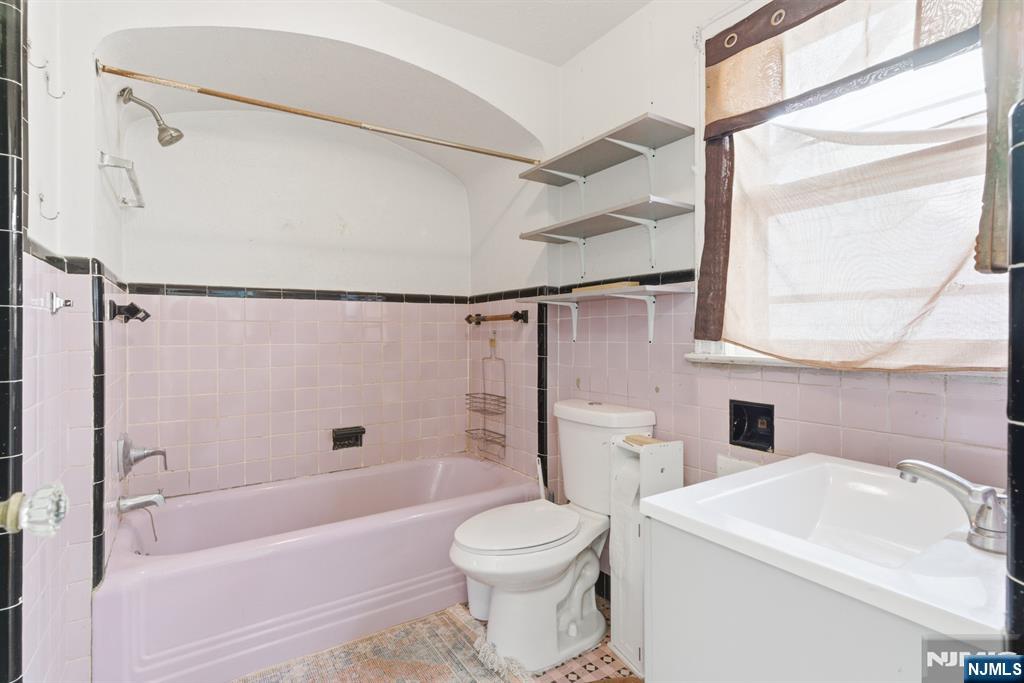 327 Field Place Hillside, NJ 07205 - Photo 11 of 18 a bathroom with a sink toilet and shower