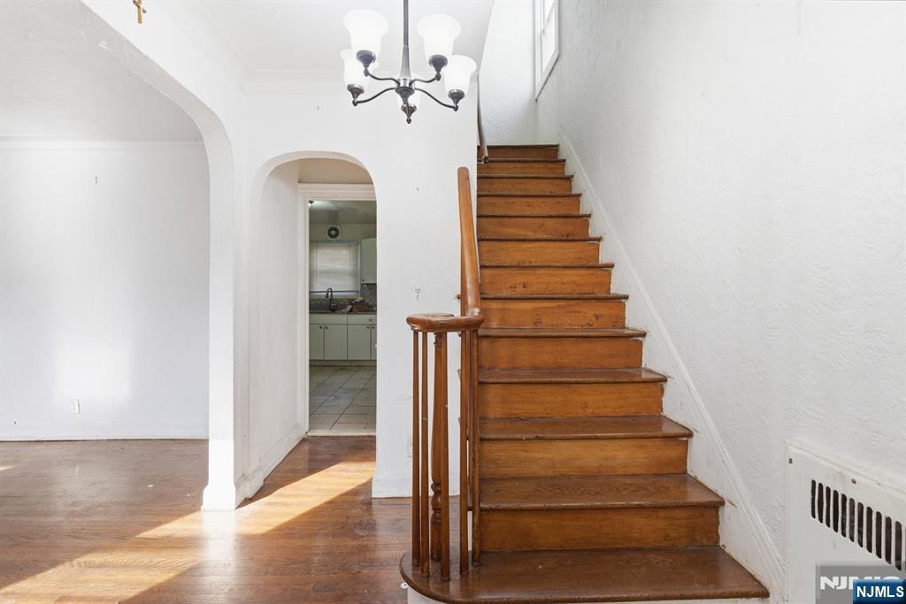 327 Field Place Hillside, NJ 07205 - Photo 6 of 18 a view of entryway and hall with wooden floor