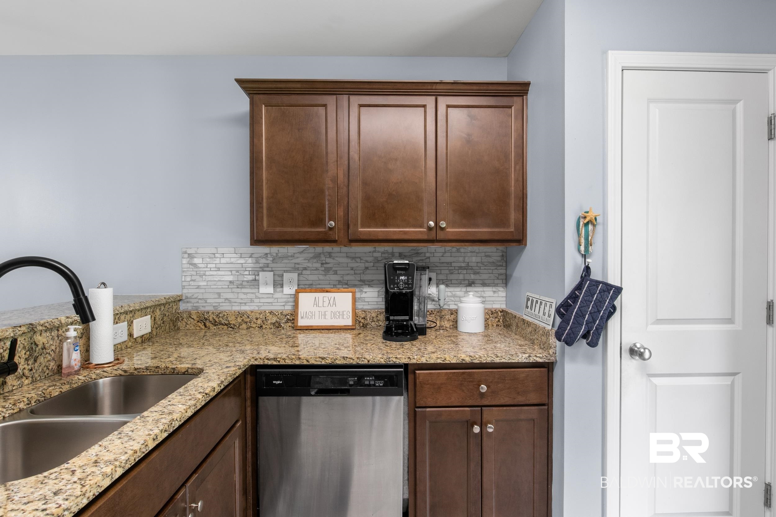 3852 Chesterfield Lane Foley, AL 36535 - Photo 19 of 34 Kitchen featuring dishwasher, light stone counters, sink, and tasteful backsplash