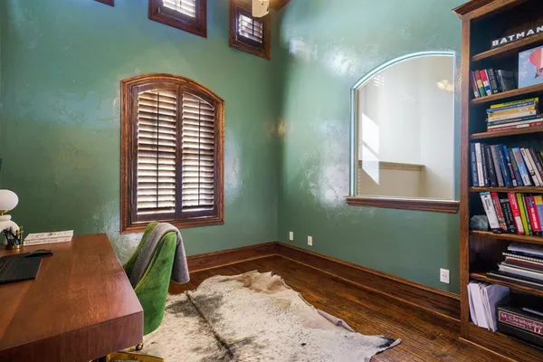 a view of a livingroom with furniture and a window