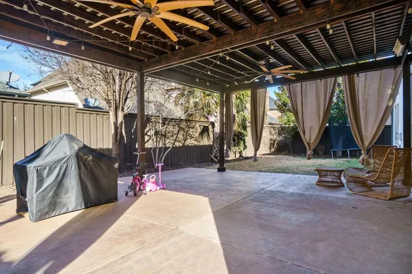 a view of a room with wooden floor and outdoor seating