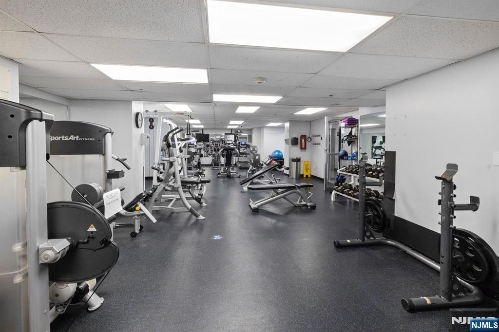 6600 JFK Boulevard East, Unit 23J West New York, NJ 07093 - Photo 14 of 26 a view of a room with gym equipment