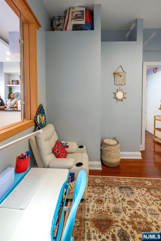 6600 JFK Boulevard East, Unit 23J West New York, NJ 07093 - Photo 16 of 26 a bedroom with a bed and wooden floor