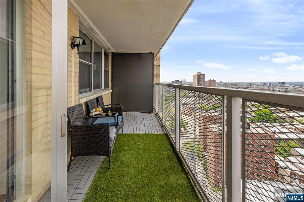 6600 JFK Boulevard East, Unit 23J West New York, NJ 07093 - Photo 20 of 26 a view of balcony with furniture