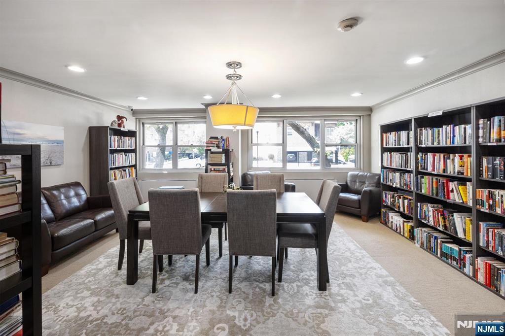 6600 JFK Boulevard East, Unit 23J West New York, NJ 07093 - Photo 23 of 26 a view of a dining room with furniture window and wooden floor
