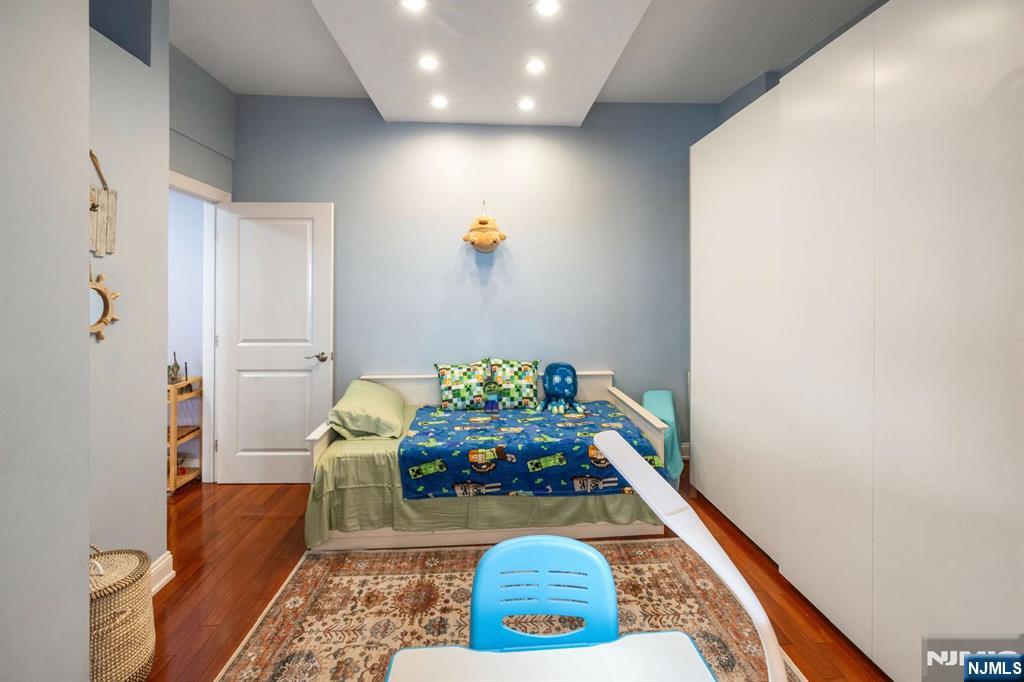 6600 JFK Boulevard East, Unit 23J West New York, NJ 07093 - Photo 5 of 26 a living room with furniture