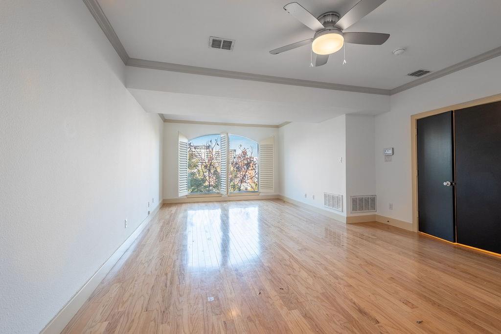 2706 Floyd Street Dallas, TX 75204 - Photo 14 of 22 wooden floor in an empty room with a window