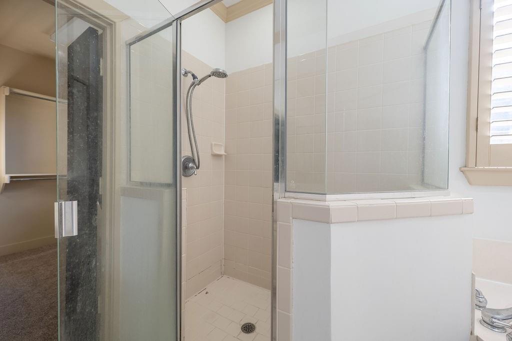 2706 Floyd Street Dallas, TX 75204 - Photo 17 of 22 a bathroom with a glass shower door