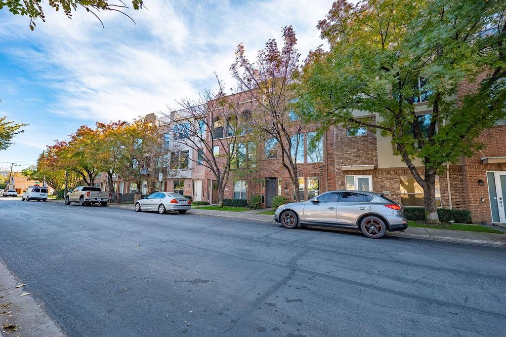 2706 Floyd Street Dallas, TX 75204 - Photo 3 of 22 a car parked in front of a house next to a road