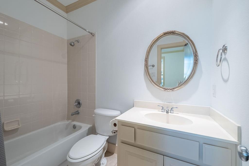 2706 Floyd Street Dallas, TX 75204 - Photo 7 of 22 a bathroom with a sink toilet and a mirror