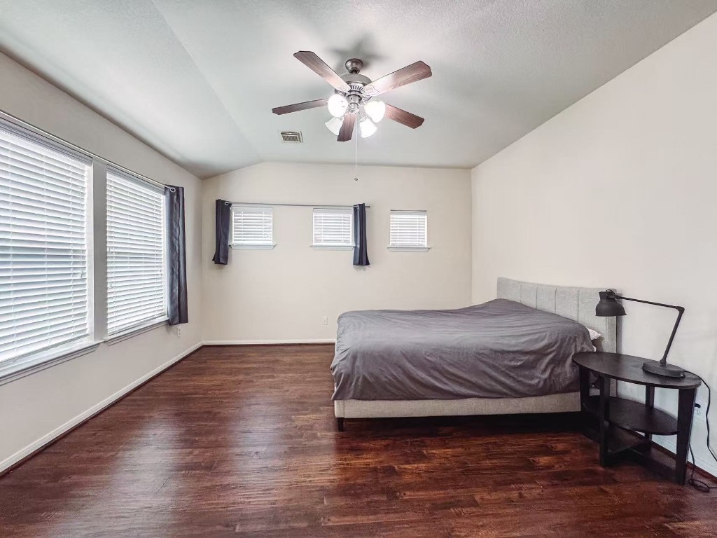 3923 Calgary Circle Missouri City, TX 77459 - Photo 13 of 25 a bedroom with a bed and window