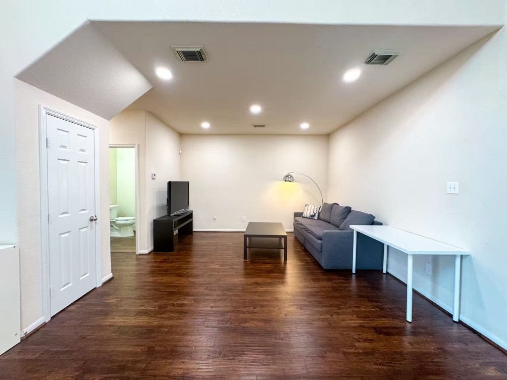 3923 Calgary Circle Missouri City, TX 77459 - Photo 5 of 25 a living room with furniture and a wooden floor