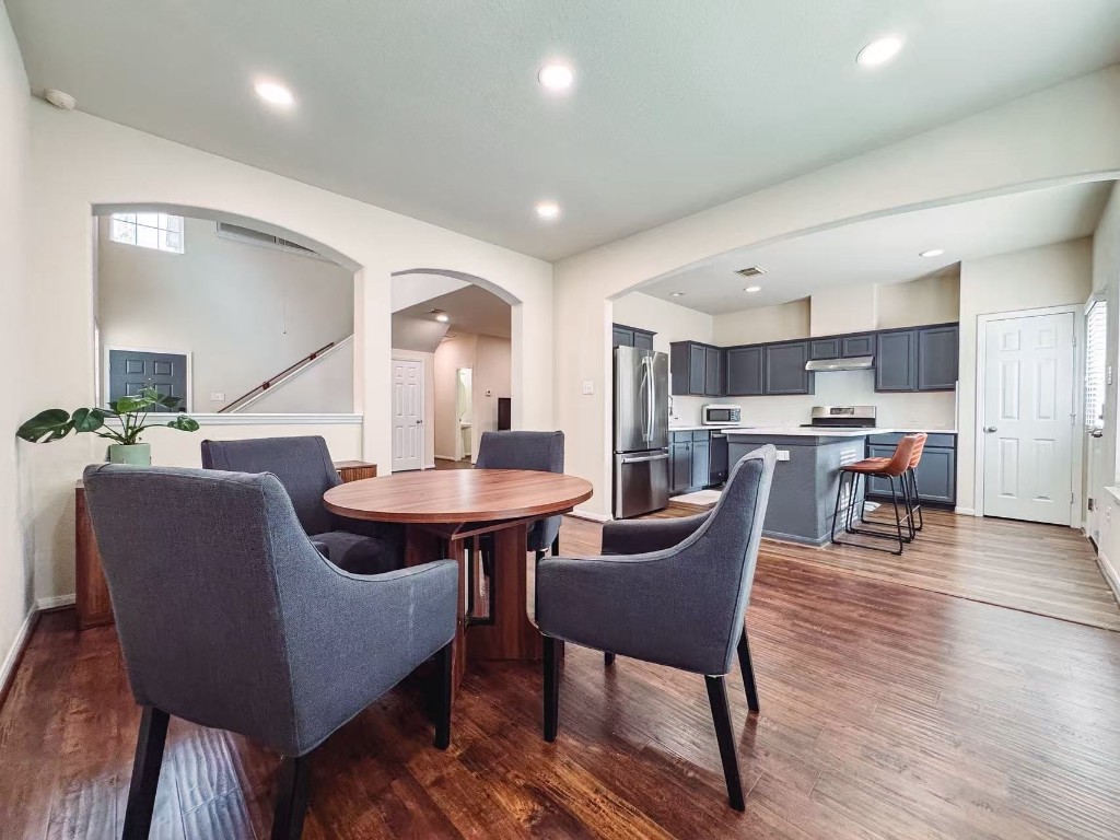 3923 Calgary Circle Missouri City, TX 77459 - Photo 6 of 25 a dining room with furniture and wooden floor
