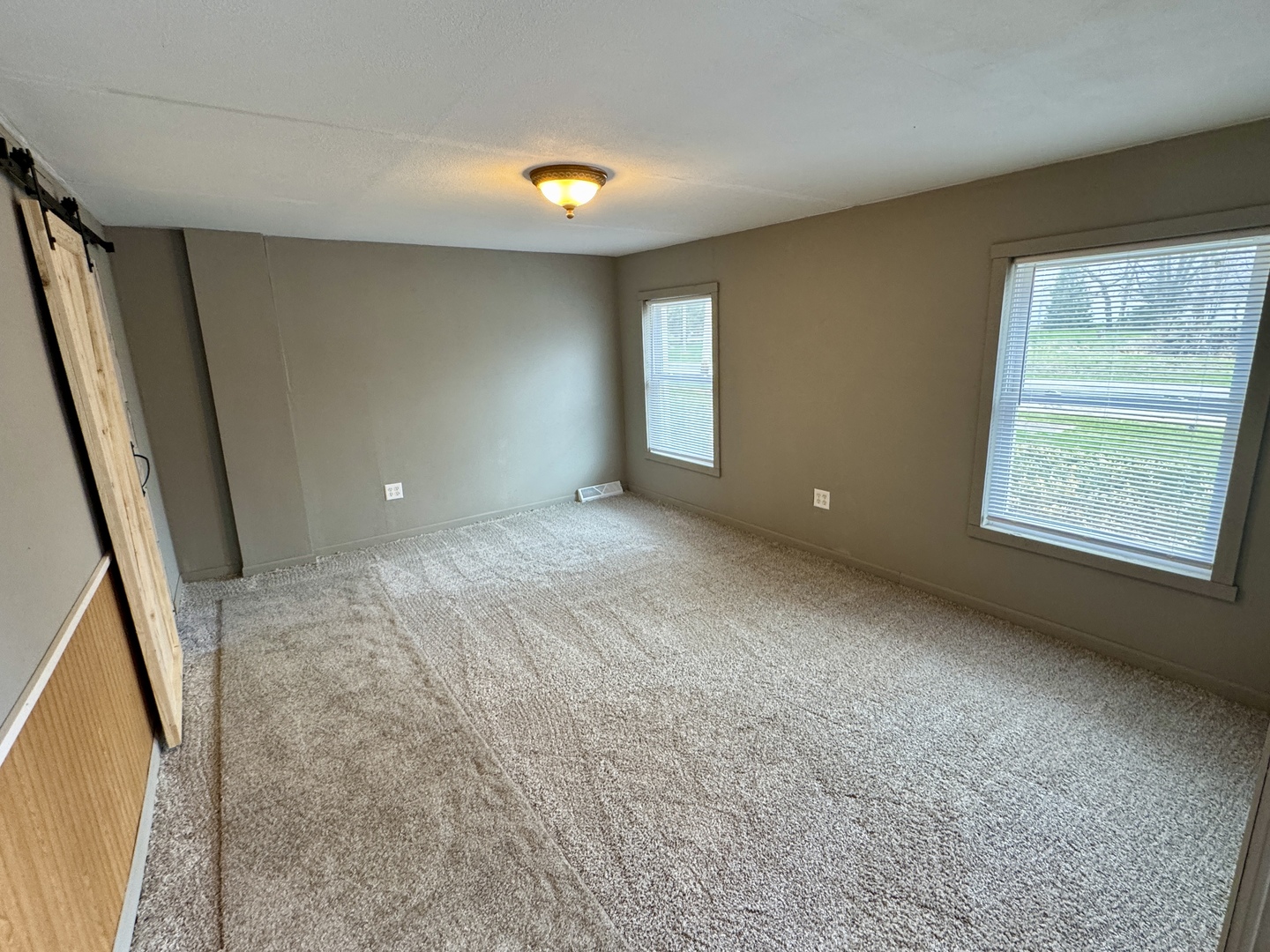 405 North 4th Street Neponset, IL 61345 - Photo 7 of 20 an empty room with windows and entrance