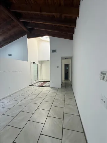 a white toilet and tub sitting next to a bathroom sink