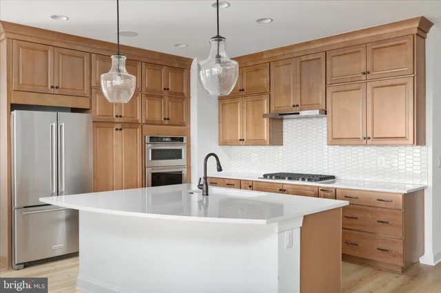 a view of a livingroom with a fireplace wooden floor and window