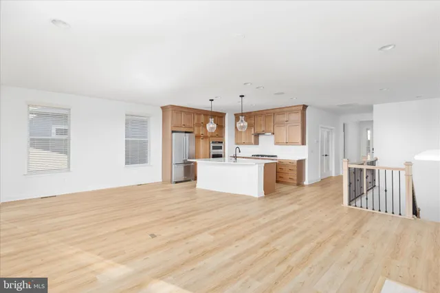 a living room with a fireplace and a window