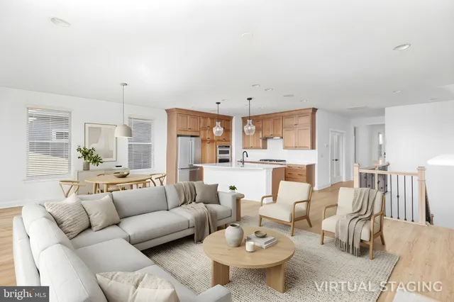 a utility room with stainless steel appliances granite countertop a sink stove and cabinets
