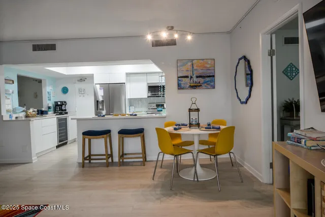 a room with furniture a rug and white walls