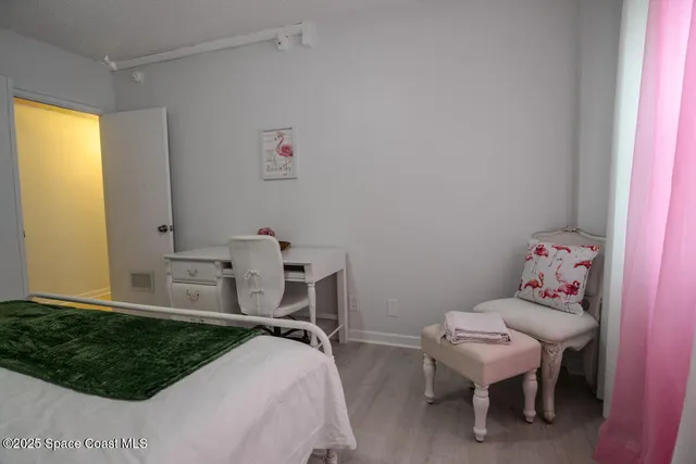 a bedroom with a bed and a table in it