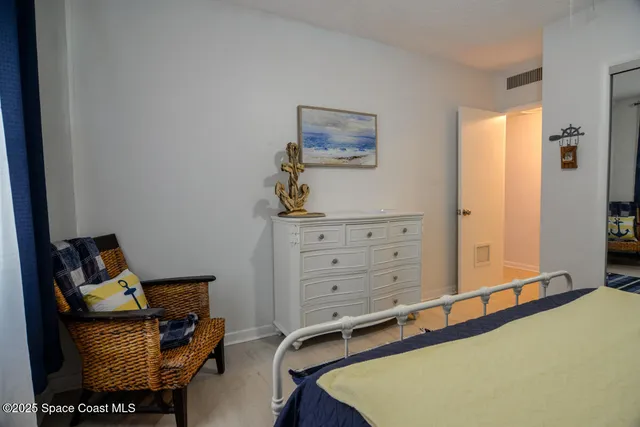 a room with closet and wooden floor