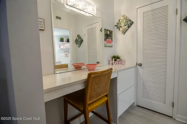 a workspace with furniture and window