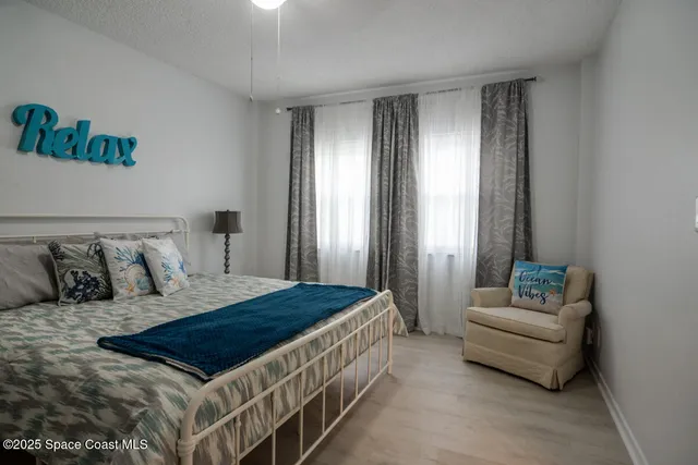 a bedroom with a bed and a couch