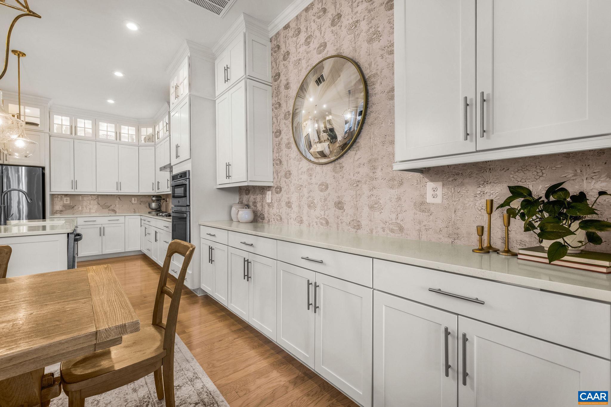 2744 Lockerbie Lane Keswick, VA 22947 - Photo 16 of 75 a kitchen with stainless steel appliances granite countertop a white cabinets and a sink