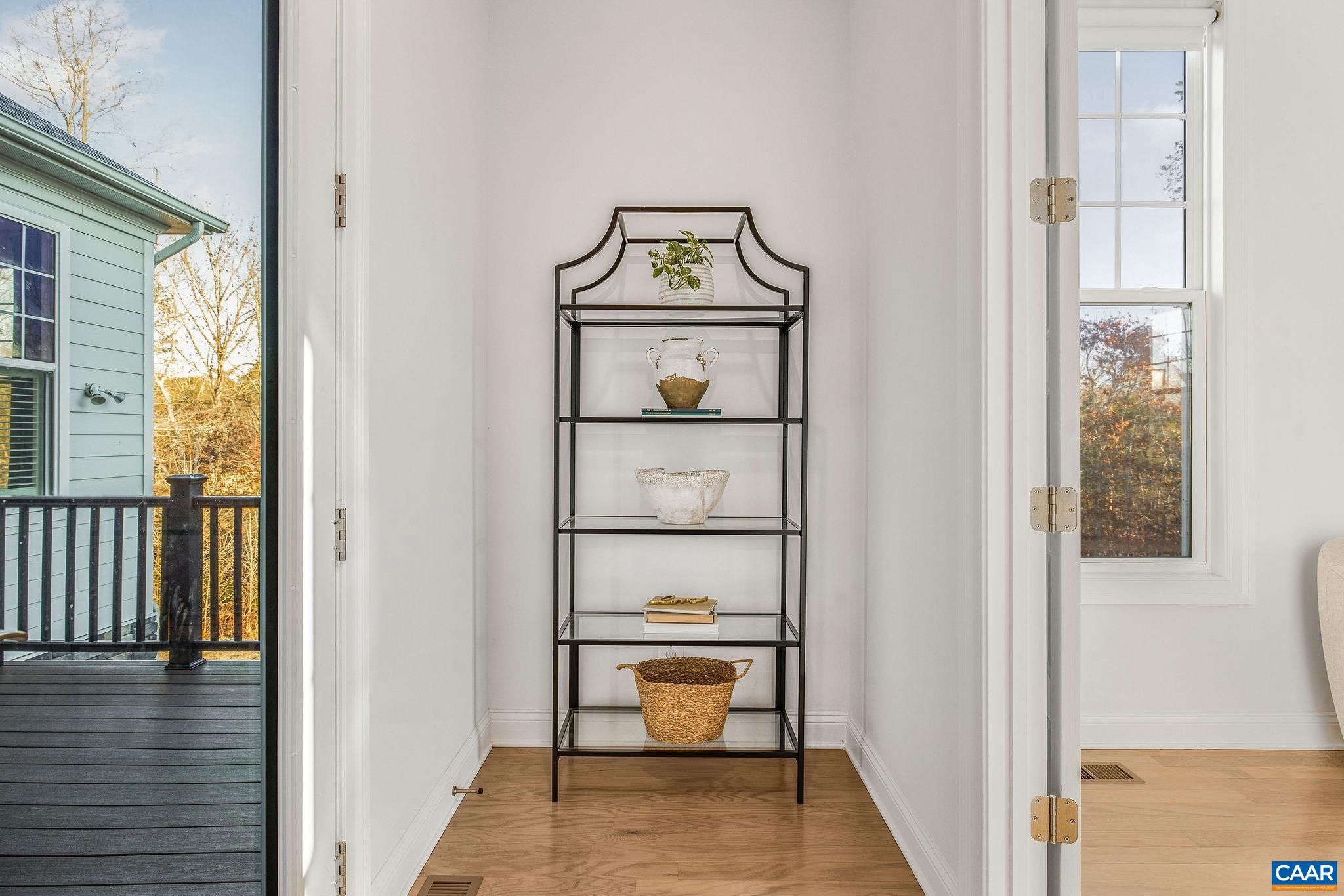 2744 Lockerbie Lane Keswick, VA 22947 - Photo 21 of 75 a view of a hallway with wooden floor and furniture