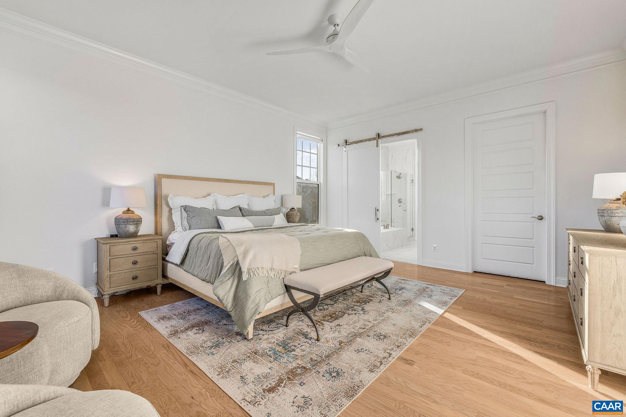 2744 Lockerbie Lane Keswick, VA 22947 - Photo 22 of 75 a bedroom with a bed and a couch