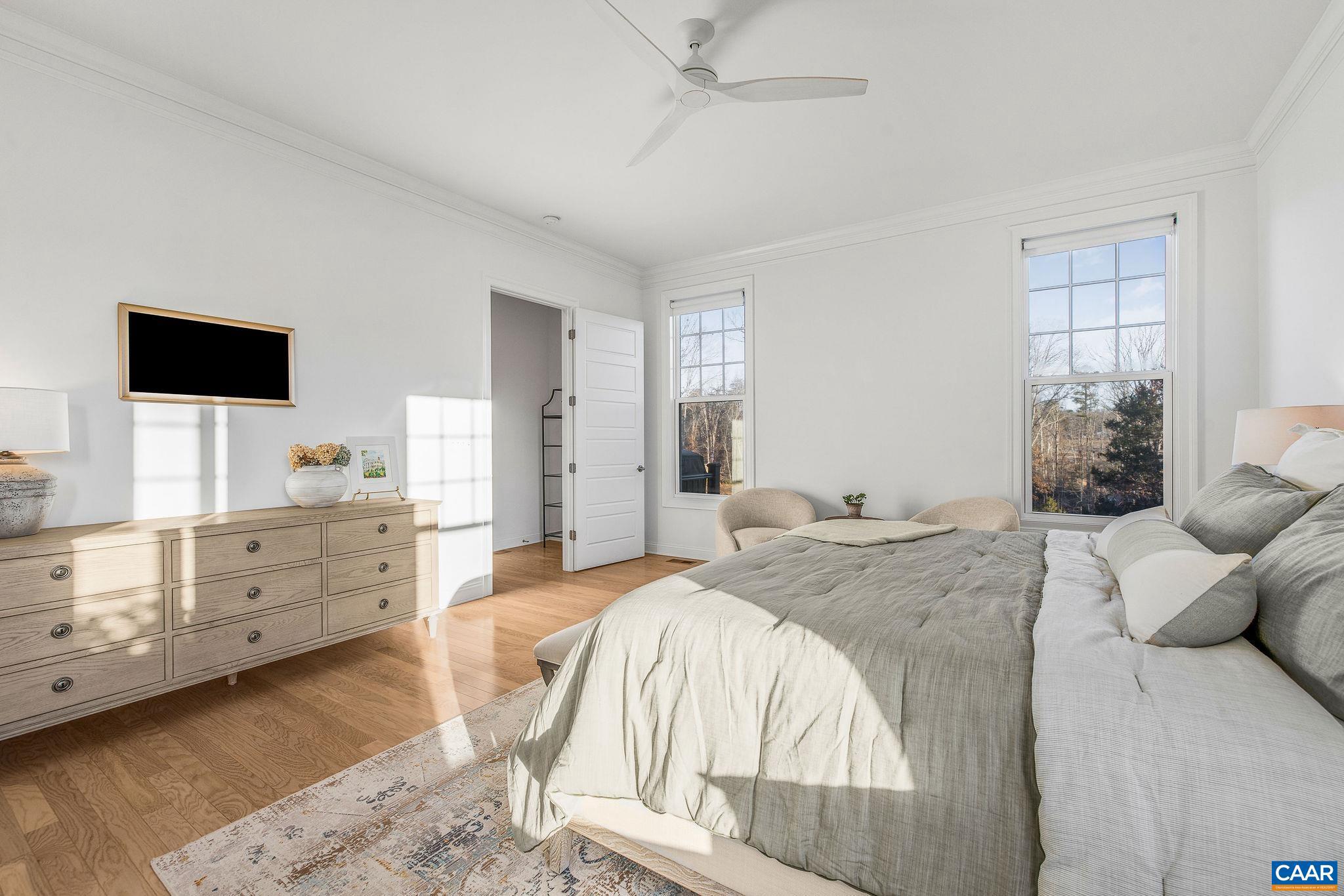 2744 Lockerbie Lane Keswick, VA 22947 - Photo 23 of 75 a bed room with furniture and a flat screen tv