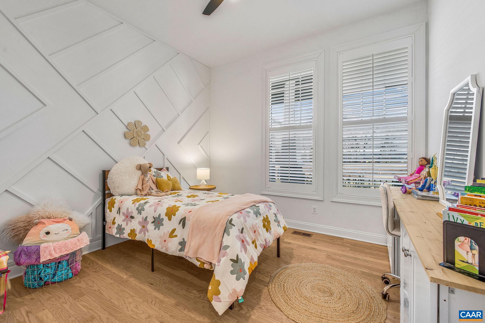 2744 Lockerbie Lane Keswick, VA 22947 - Photo 28 of 75 a bedroom with a bed and a chandelier