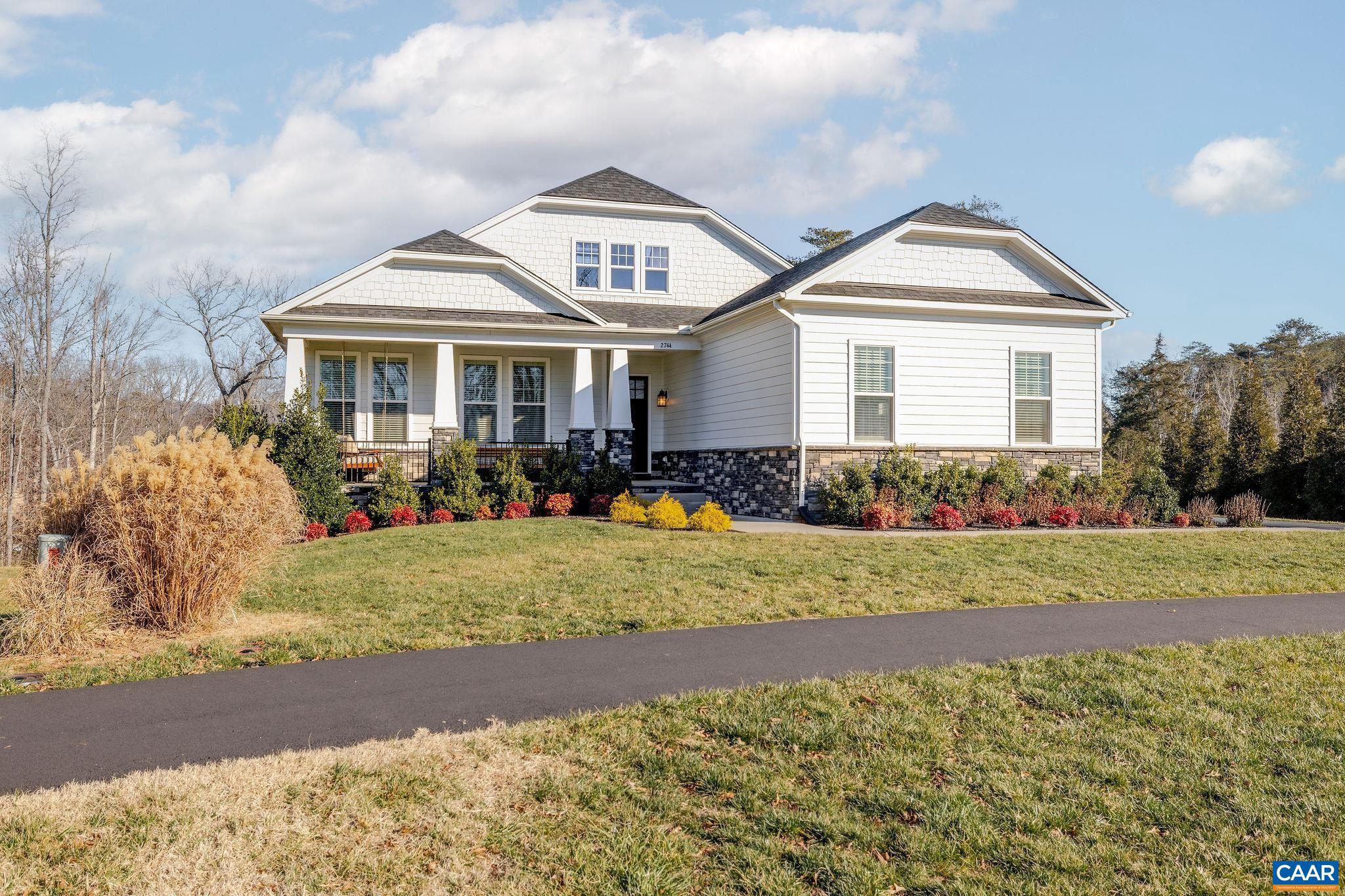 2744 Lockerbie Lane Keswick, VA 22947 - Photo 3 of 75 a front view of a house with garden