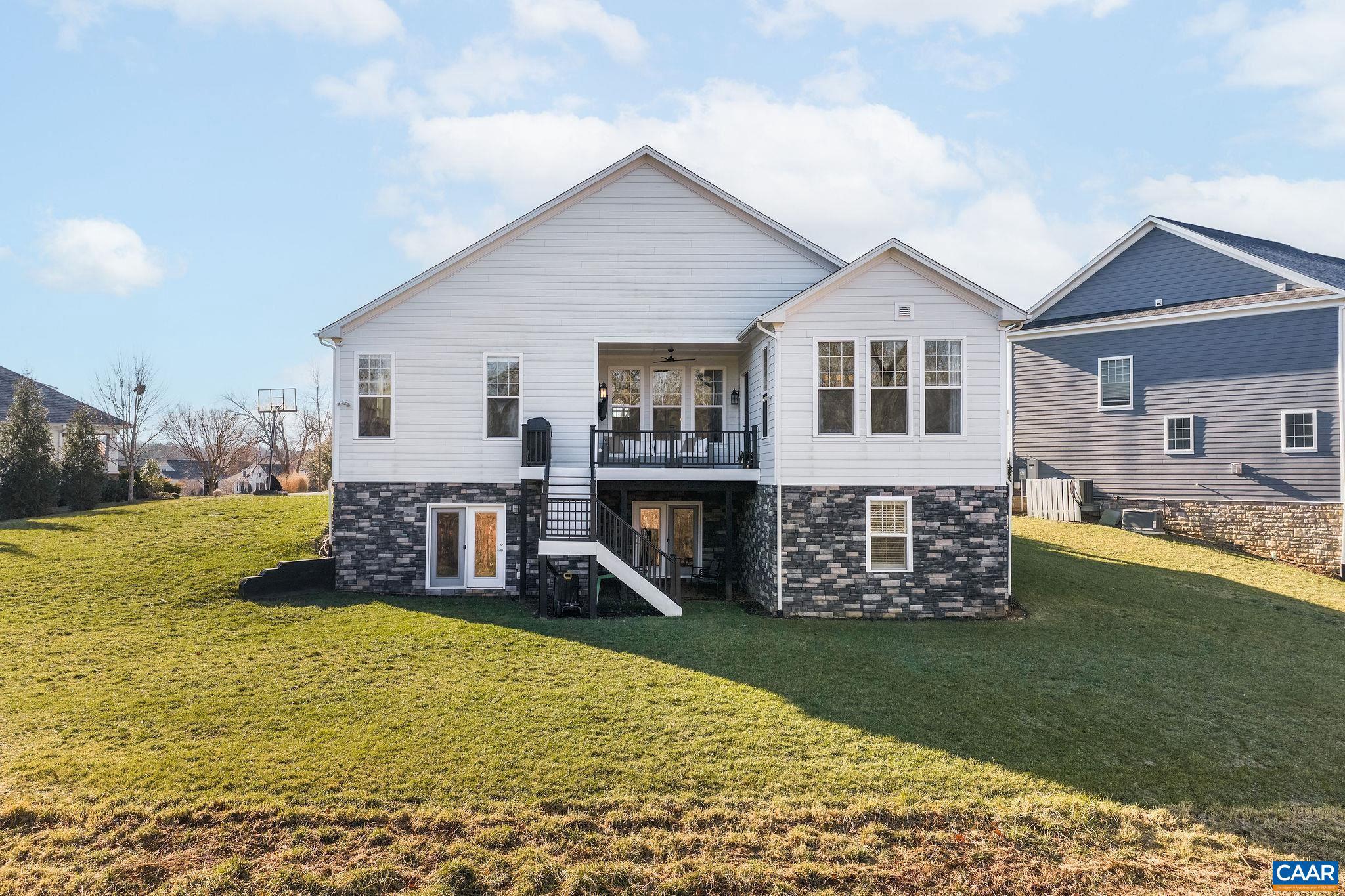 2744 Lockerbie Lane Keswick, VA 22947 - Photo 45 of 75 a view of a house with a yard patio and a yard