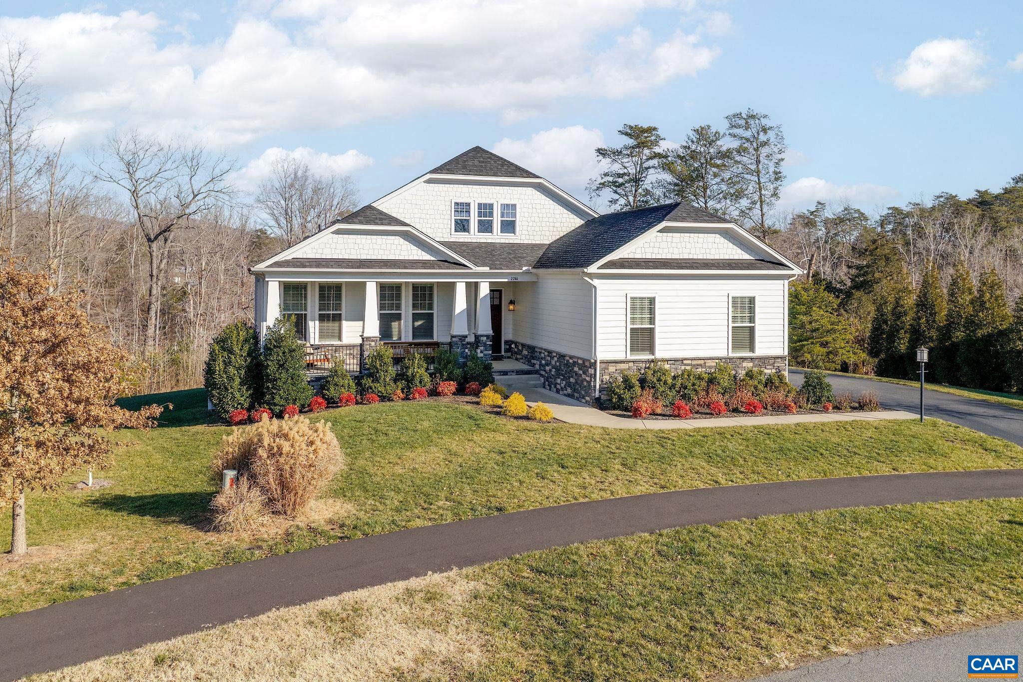 2744 Lockerbie Lane Keswick, VA 22947 - Photo 46 of 75 a front view of a house with a garden and pathway