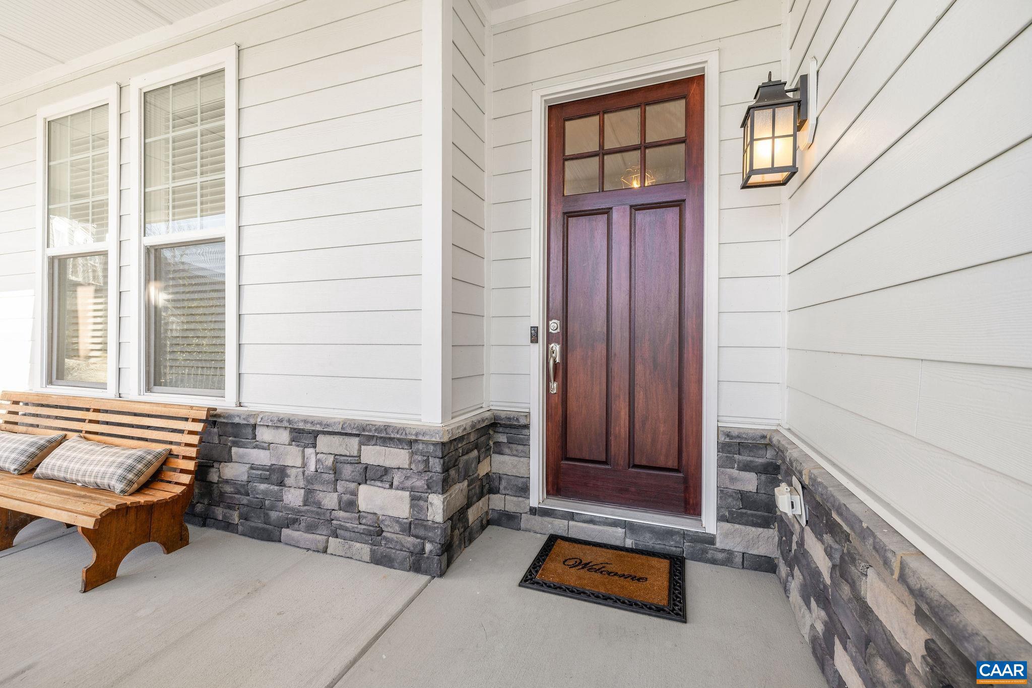 2744 Lockerbie Lane Keswick, VA 22947 - Photo 56 of 75 a backyard of a house with barbeque oven and outdoor seating