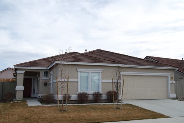 1680 Canyonlands Way Reno, NV 89521 - Photo 1 of 9 a front view of a house with garden