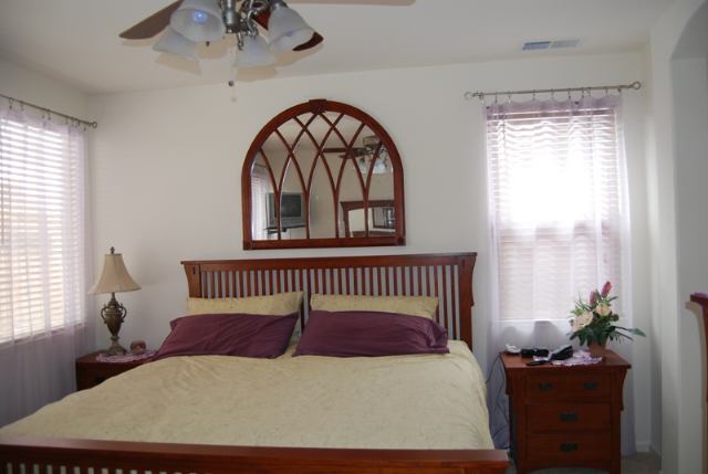 1680 Canyonlands Way Reno, NV 89521 - Photo 7 of 9 a bedroom with a bed and a window