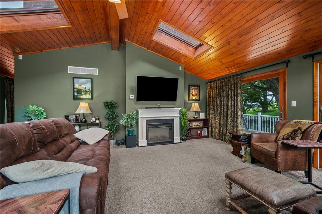 2387 Harrison City Road Export, PA 15632 - Photo 19 of 48 a living room with furniture a fireplace and a flat screen tv