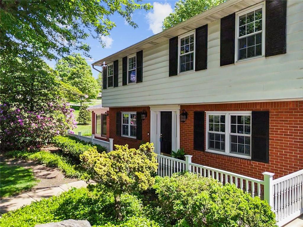 2387 Harrison City Road Export, PA 15632 - Photo 2 of 48 front view of a house with a garden