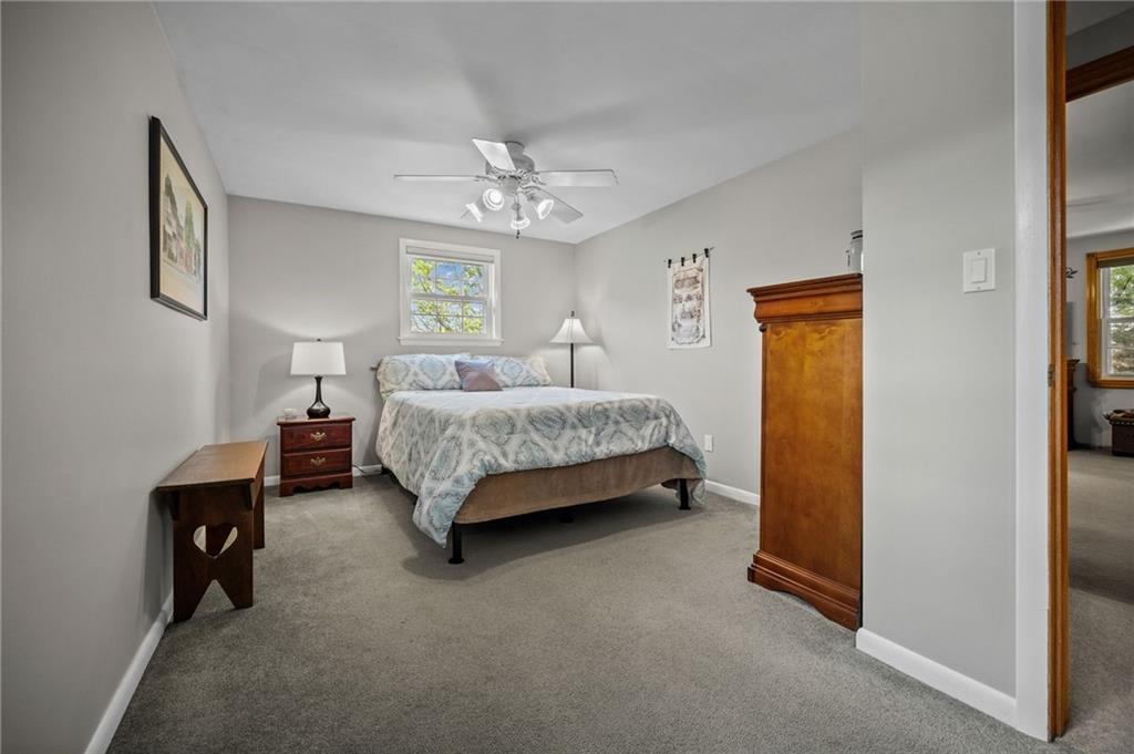 2387 Harrison City Road Export, PA 15632 - Photo 24 of 48 a bedroom with a bed and a chandelier