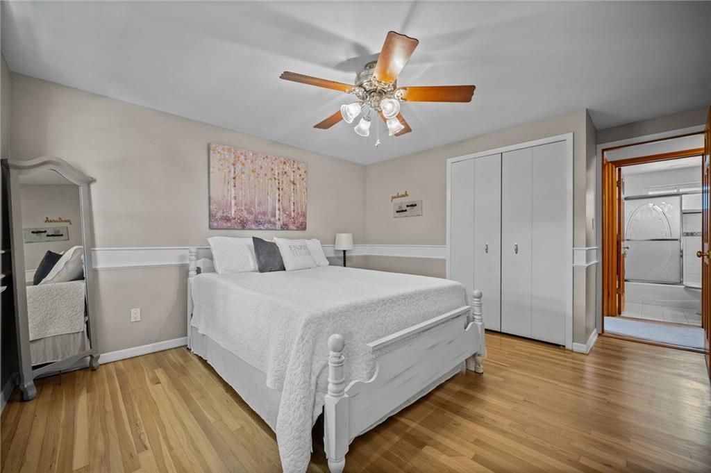 2387 Harrison City Road Export, PA 15632 - Photo 28 of 48 a bedroom with a bed and a chandelier