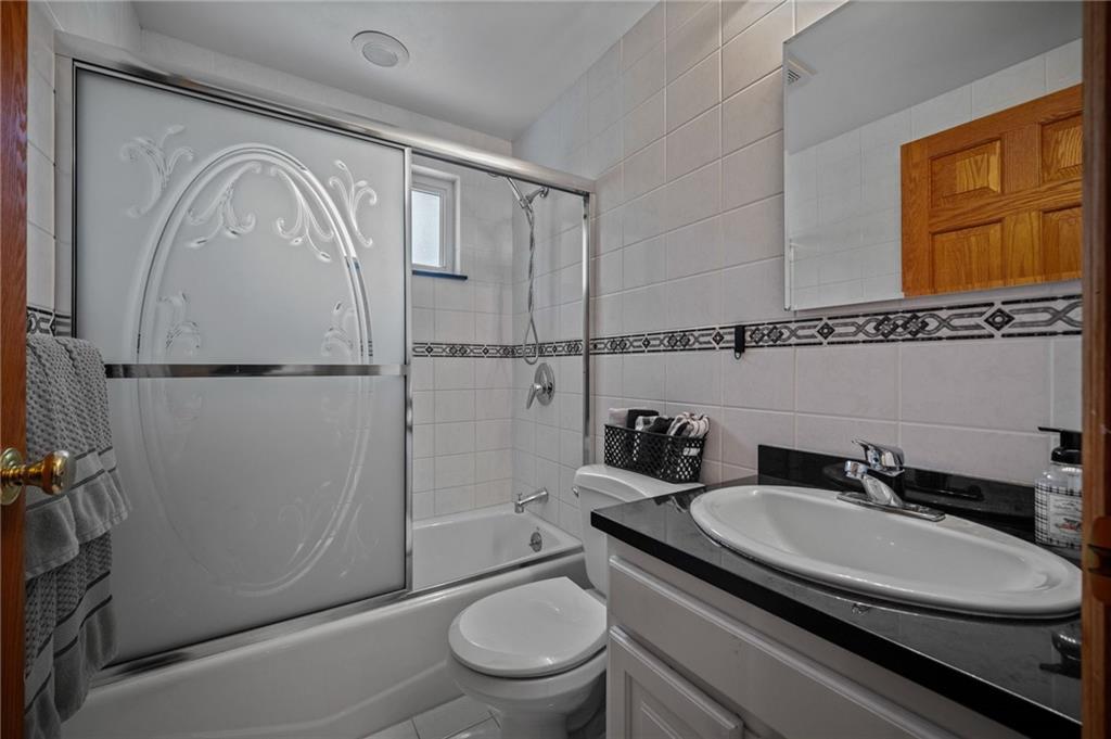 2387 Harrison City Road Export, PA 15632 - Photo 29 of 48 a bathroom with a granite countertop sink toilet and shower